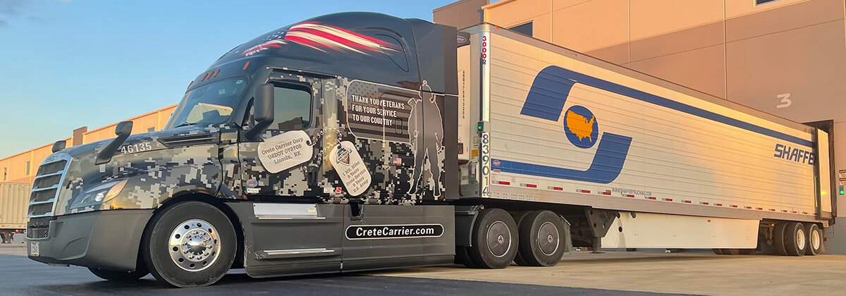A Shaffer Patriot Fleet driver makes a delivery to a grocery retailer's unloading dock.
