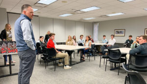 Crete Carrier President and COO Tim Aschoff addresses a class of interns and Crete employee trainers at the 2023 intern orientation