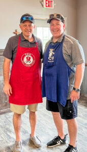 Crete COO Tim Aschoff and Shaffer Trucking President Erick Kutter were the grill masters for a 2023 summer intern cookout