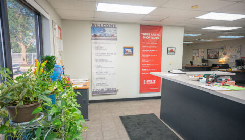 Welcome and Seven Principles banners at the front reception desk of the Columbus, Ohio terminal